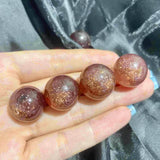 Strawberry Quartz Spheres with Strong Golden Sheen